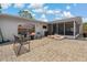 Spacious patio with seating area, lounge chairs, and a view of the pool at 107 Elm N Sq, Lakeland, FL 33813