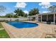 Backyard pool with deck and view of the house at 107 Elm N Sq, Lakeland, FL 33813