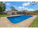 Pool and patio area with furniture, grill, and privacy fence at 107 Elm N Sq, Lakeland, FL 33813