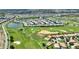 The property location in this aerial view sits on a golf course near a pond, marked by a red pin at 1423 Bunker Dr, Davenport, FL 33896