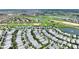 An aerial view of a neighborhood that sits on a golf course; a red pin indicates the location of the property at 1423 Bunker Dr, Davenport, FL 33896
