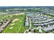 An aerial view shows the location of the property on a golf course, located near a pond, indicated by a red pin at 1423 Bunker Dr, Davenport, FL 33896