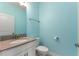 This is a bathroom featuring light blue walls, a sink, and a toilet at 1423 Bunker Dr, Davenport, FL 33896
