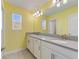 Bathroom featuring a double vanity with modern fixtures and ample counter space at 1423 Bunker Dr, Davenport, FL 33896
