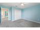 Bright bedroom with closet and ceiling fan at 1423 Bunker Dr, Davenport, FL 33896