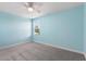 Bright bedroom featuring neutral carpet and a window with exterior views at 1423 Bunker Dr, Davenport, FL 33896