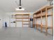 Spacious garage with built-in shelving and ample storage space at 1423 Bunker Dr, Davenport, FL 33896