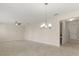 Bright and airy living room featuring tile floors and modern lighting fixtures at 1423 Bunker Dr, Davenport, FL 33896
