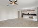 Spacious living room featuring tiled floors and an open layout that connects to the kitchen at 1423 Bunker Dr, Davenport, FL 33896