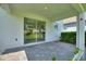 Covered patio area with sliding glass doors leading to backyard at 1423 Bunker Dr, Davenport, FL 33896