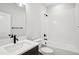 Bathroom featuring a shower/tub combo, a white vanity, and modern black finishes at 216 E Harding St, Orlando, FL 32806