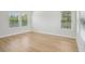 Bright bedroom featuring sleek hardwood floors and bright windows at 216 E Harding St, Orlando, FL 32806