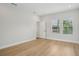 Bright bedroom featuring sleek hardwood floors and bright windows at 216 E Harding St, Orlando, FL 32806