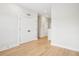 Spacious bedroom features hardwood floors, a double door closet, and white trim at 216 E Harding St, Orlando, FL 32806