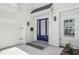 Close-up of a charming doorway, with a black mailbox and coach lights at 216 E Harding St, Orlando, FL 32806