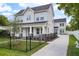 Charming two-story home with a well-maintained lawn and a classic black metal fence at 216 E Harding St, Orlando, FL 32806