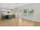 Open concept eat-in kitchen with a center island and stainless steel appliances at 216 E Harding St, Orlando, FL 32806