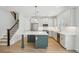 Modern kitchen with stainless appliances, a spacious center island, and ample cabinet space at 216 E Harding St, Orlando, FL 32806