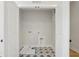 The laundry room boasts starburst tile floors and hookups at 216 E Harding St, Orlando, FL 32806