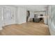 Open concept living room and kitchen with hardwood floors at 216 E Harding St, Orlando, FL 32806