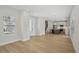 Spacious living room featuring hardwood floors with the kitchen area adjacent at 216 E Harding St, Orlando, FL 32806