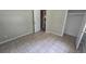 Bedroom with Tile floors, Neutral Paint, Closet and an electrical outlet at 3115 Lake Arnold Pl, Orlando, FL 32806