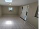Neutral bedroom features large windows, ceiling fan, and tiled flooring at 3115 Lake Arnold Pl, Orlando, FL 32806