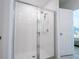 Modern bathroom featuring a glass-enclosed shower with a sleek showerhead and faucet at 573 Vista Villages Blvd, Davenport, FL 33896