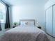 Bedroom filled with light featuring a comfortable bed and neutral decor at 573 Vista Villages Blvd, Davenport, FL 33896