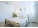 Cozy bedroom with a comfortable bed, soft lighting, and minimalist decor at 573 Vista Villages Blvd, Davenport, FL 33896