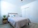 Light-filled bedroom with modern furniture and spacious closet at 573 Vista Villages Blvd, Davenport, FL 33896