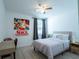 Bright bedroom features a desk and chair, ideal for work or study at 573 Vista Villages Blvd, Davenport, FL 33896