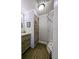 Updated bathroom with shower and unique wood-look cabinetry featuring plenty of storage at 85 Heather Point Ct # 850, New Smyrna Beach, FL 32169