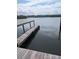 Picturesque view of a wooden dock extending into the calm water at 85 Heather Point Ct # 850, New Smyrna Beach, FL 32169