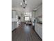 Open floor plan connecting the kitchen and living area featuring matching hard surface floors throughout at 85 Heather Point Ct # 850, New Smyrna Beach, FL 32169