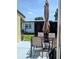Outdoor patio with an umbrella table and chairs, perfect for entertaining at 85 Heather Point Ct # 850, New Smyrna Beach, FL 32169