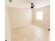 Clean bedroom with tile floor, window for natural light, and ceiling fan at 1510 Avleigh Cir, Orlando, FL 32824