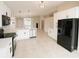 Modern kitchen featuring white cabinets, stainless steel appliances, and a breakfast bar at 1510 Avleigh Cir, Orlando, FL 32824