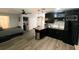 Studio apartment featuring a modern kitchenette, bed, and closet space at 1510 Avleigh Cir, Orlando, FL 32824
