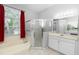 Bright bathroom with a shower, tub, and double vanity at 433 Woodcrest St, Winter Springs, FL 32708