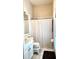 Bathroom featuring a white shower curtain, toilet with step stool, and a vanity at 433 Woodcrest St, Winter Springs, FL 32708
