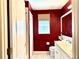 Bathroom featuring a toilet, vanity, white door, and a shower with white tiles at 433 Woodcrest St, Winter Springs, FL 32708