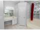 Bathroom with bath tub, window with red curtains, and a vanity with drawers at 433 Woodcrest St, Winter Springs, FL 32708