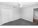 Bedroom with closet, ceiling fan, and attached bathroom at 433 Woodcrest St, Winter Springs, FL 32708