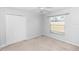 Bedroom with a window, ceiling fan and closet at 433 Woodcrest St, Winter Springs, FL 32708