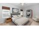 Comfortable bedroom with neutral tones, a plush bed, and decorative artwork, creating a relaxing ambiance at 433 Woodcrest St, Winter Springs, FL 32708