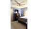 This bedroom features carpet flooring, a ceiling fan, a window and a flat screen tv at 433 Woodcrest St, Winter Springs, FL 32708