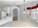 Bright breakfast nook with views of the yard and a seamless transition to the kitchen area at 433 Woodcrest St, Winter Springs, FL 32708