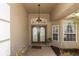 Inviting entrance with double doors, sidelights, and a covered porch, creating a grand welcome at 433 Woodcrest St, Winter Springs, FL 32708