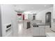 Open kitchen layout with stainless steel appliances and a view into the living and breakfast areas at 433 Woodcrest St, Winter Springs, FL 32708
